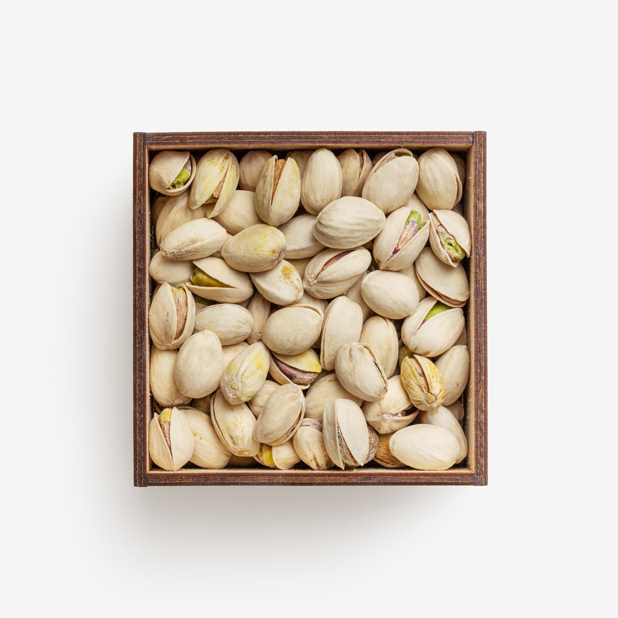 Clean Isolated PSD image of Box of pistachios on transparent background with separated shadow